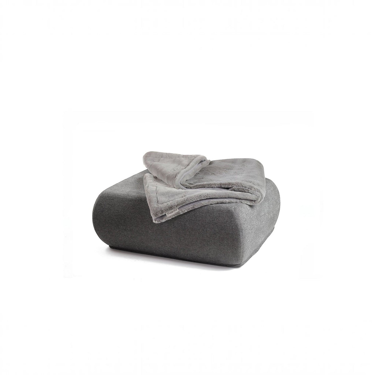 havaneser.shop Wohndecke aus grauem Webpelz und weichem Fleece, elegant gefaltet auf einem passenden Sitzhocker