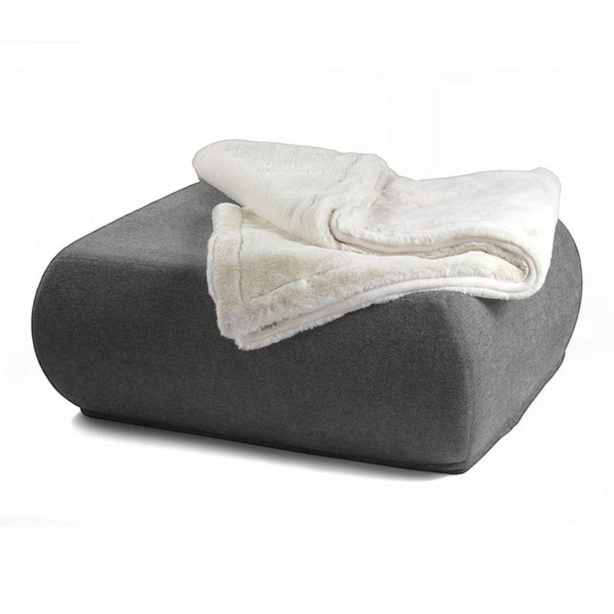havaneser.shop Wohndecke aus Webpelz in Creme auf einem grauen Polsterhocker für gemütliche Momente